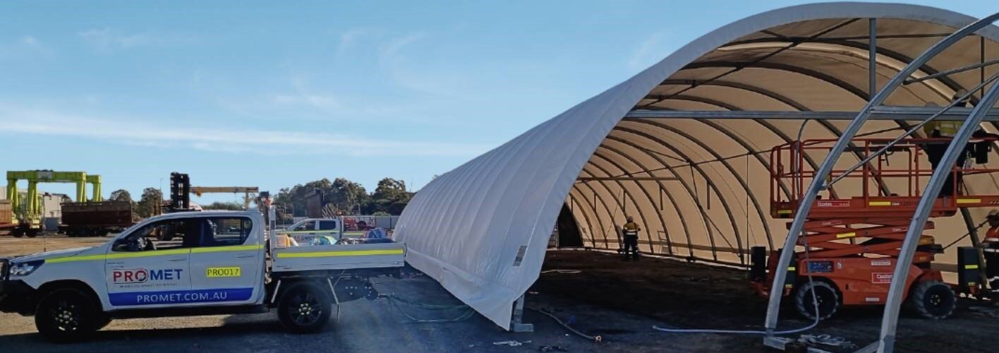 Promet Vehicle Next to Fabric Dome Shelter