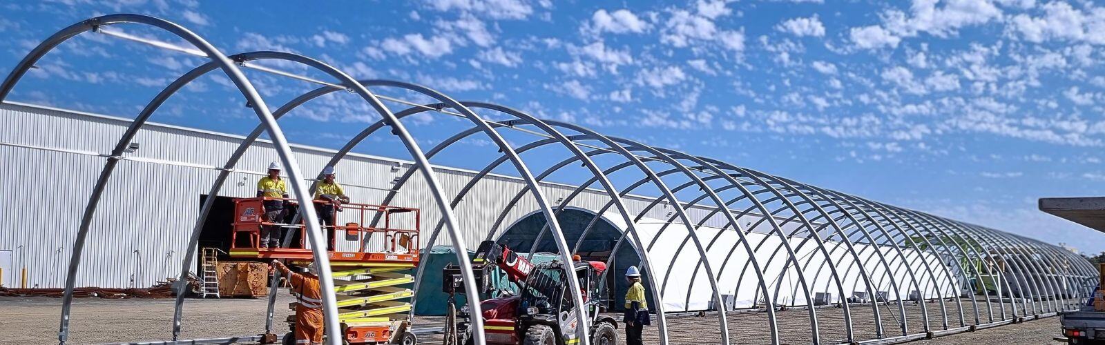 Fabric dome shelter being installed on work site